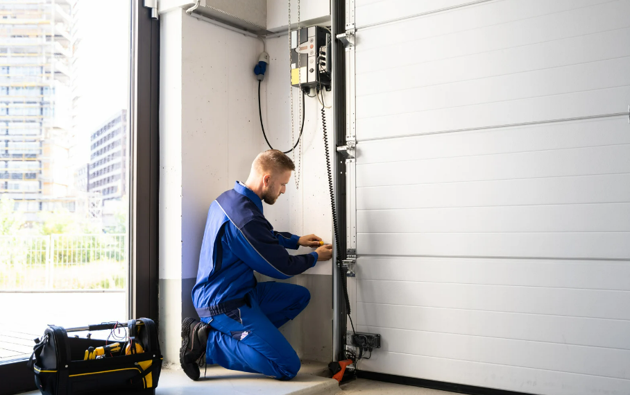 An image of a professional contractor installing an overhead garage door on Vancouver Island. 